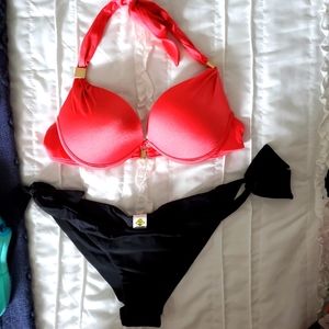 Coral colored top with cheeky black bikini bottom